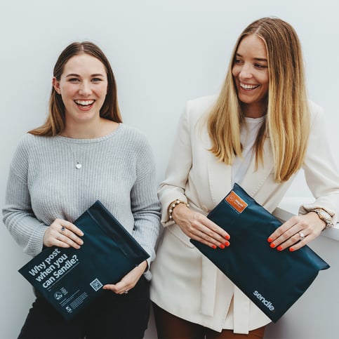 two-small-business-women-holding-satchels-happy-and-satisfied-with-their-shipping-experience-with-sendle