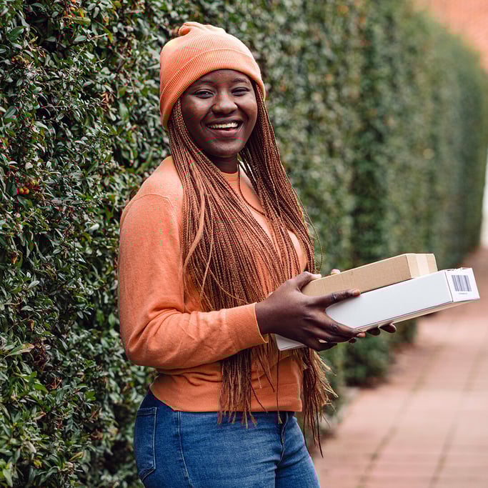 woman-returning-parcel-smiling