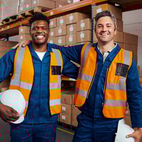 two-owner-of-logistic-company-inside-warehouse-smiling