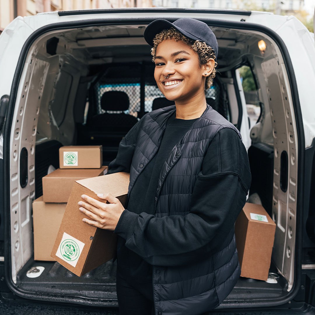 a-woman-courier-shipping-carbon-neutral-packages