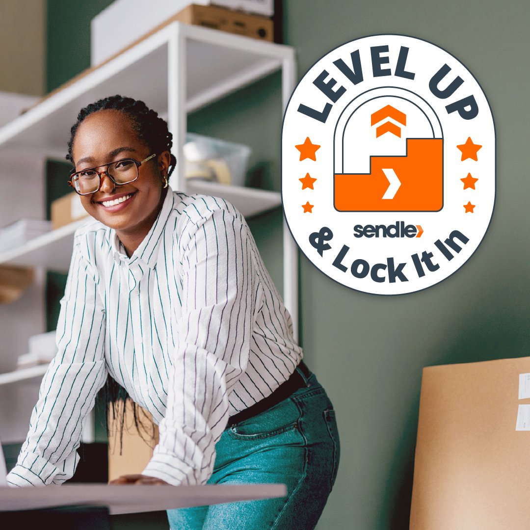 black-woman-in-shipping-office-standing-behind-desk-with-laptop
