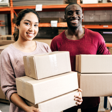 couple-holding-parcels-in-warehouse
